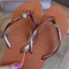 Havaianas Slim Glitter + Pin Oncinha